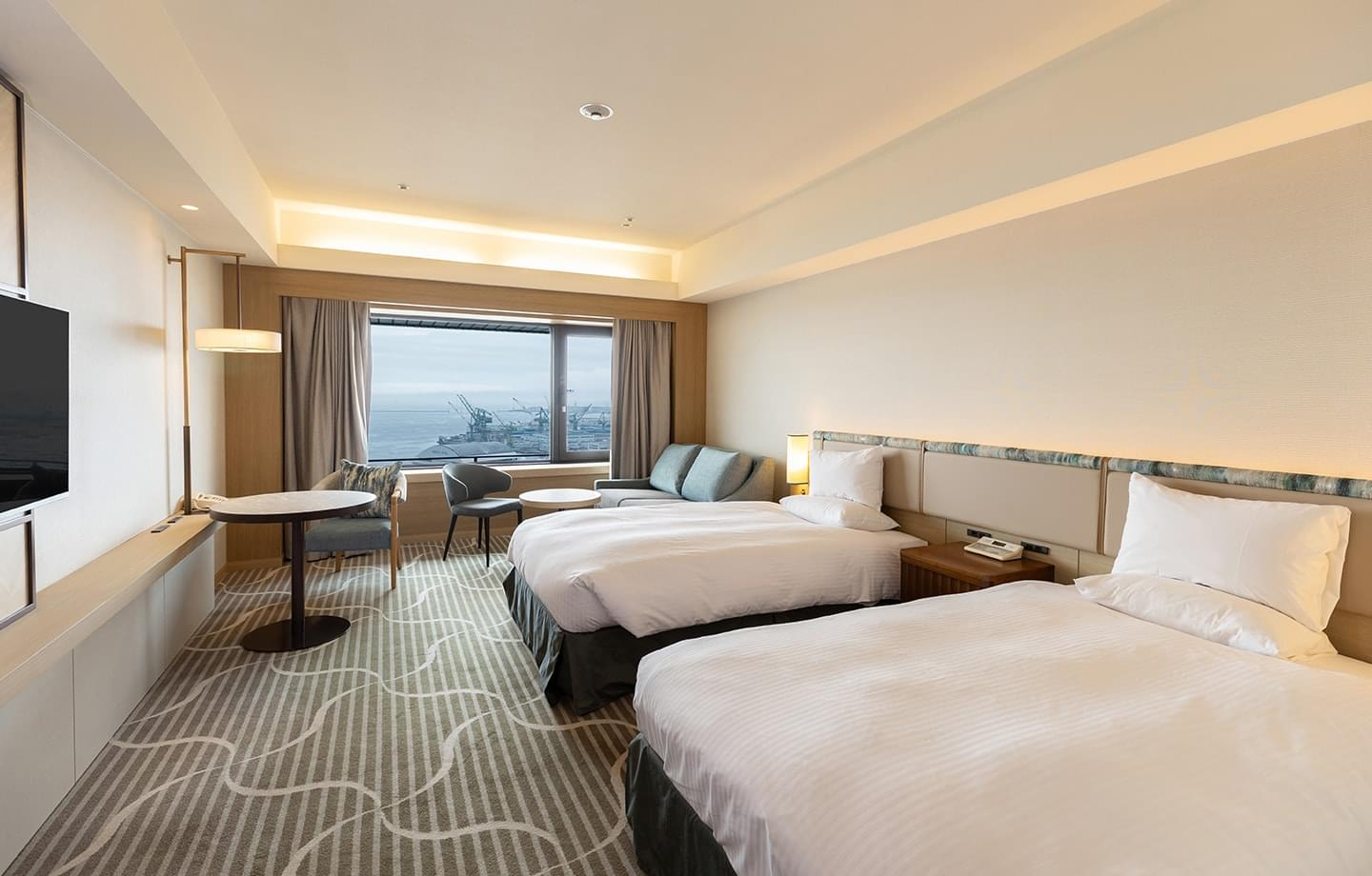 Bright hotel twin room with harbour view